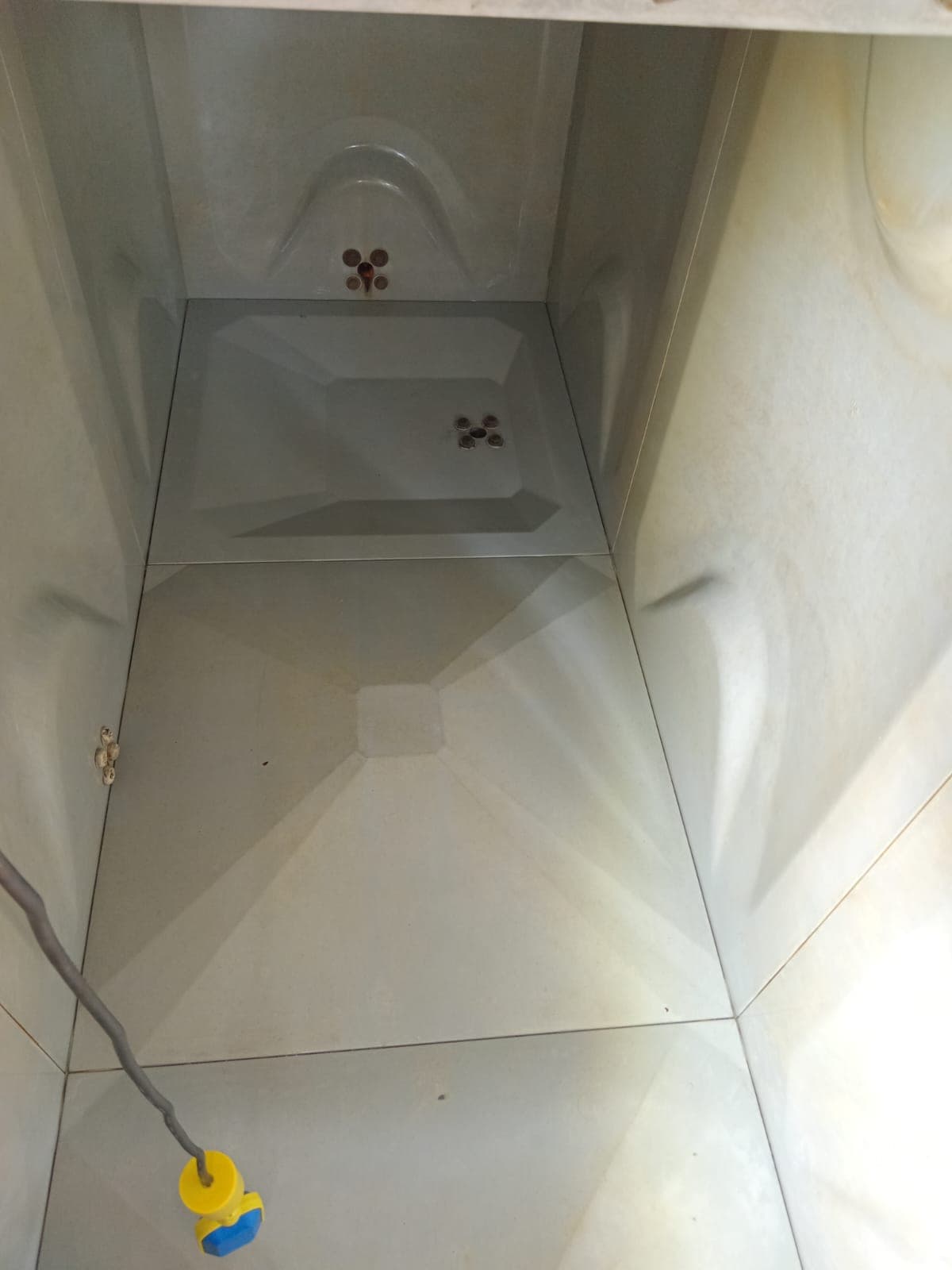 Final internal inspection view — sparkling clean tank interior confirmed before refill