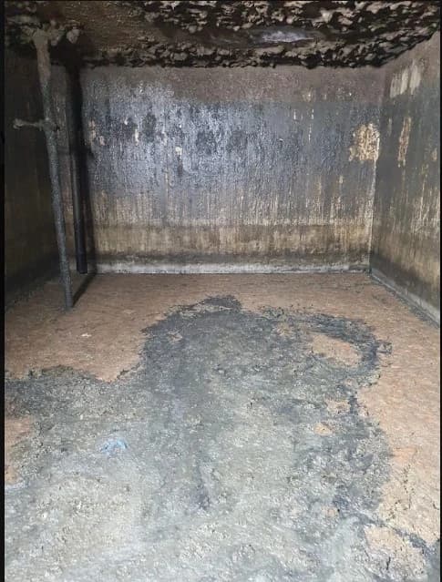 Full extent of sludge accumulation before cleaning